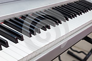 close-up of piano keys. close frontal view, black and white piano keys, viewed from above