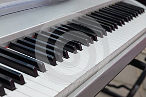 close-up of piano keys. close frontal view, black and white piano keys, viewed from above
