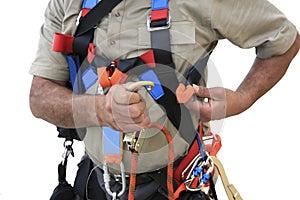 Close up pics of male industrial rope access worker wearing dressing fall arrest safety protection harness