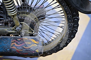 Close-up picture of the art of the rear wheel of the motorcycle, the end of the paint pipe