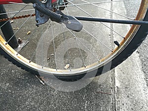 Close up picture of flat tire of old bicycle.