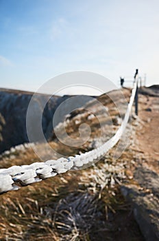 Close up picture of frost on a mountain trail chain railing