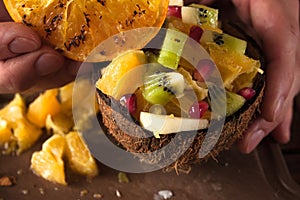 Close up picture of fruit salad in coconut shell