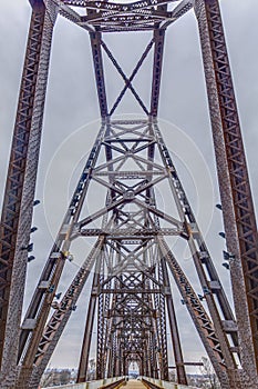 Close up picture of the impressive steel frame structure of the Big Four bridge in Louisville during daytime