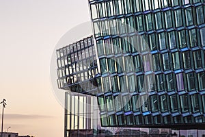 Close up picture of modern glass facade of Harpa Concert Hall