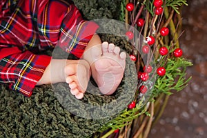 Close up picture of new born baby feet, christmas time