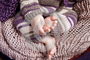 Close up picture of new born baby feet and hand