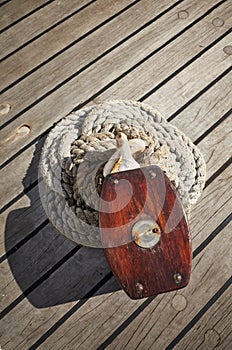 Close up picture of an old wooden pulley block