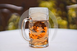 Close up picture on traditional shape mug of czech pale lager beer.