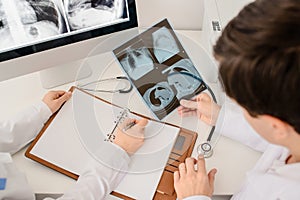 Close up picture of young doctors radiologists analyzing x-ray