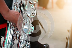 Close-up pictures of musicians playing  Baritone Saxophone  In the music practice room, blurred background
