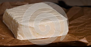 close-up of a piece of soft Caucasian cheese made from milk