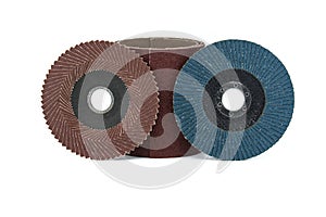 Close-up of pile of abrasive discs over white background
