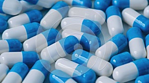 close up pile of blue-white antibiotic capsule.