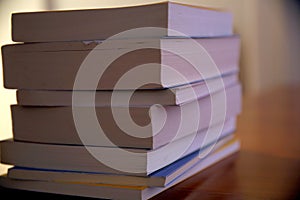 Close-up of a pile of books, view from the pages side