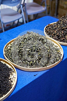 Close-up of a pile of Chinese tea leaves on a dustpan