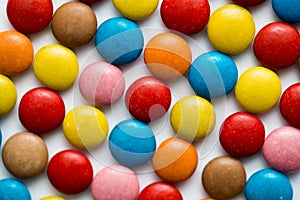Close up of a pile of colorful chocolate coated candy, chocolate pattern, chocolate background.