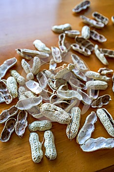 Close-up of a pile of finished peanut shells on the dining table