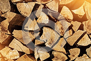 Close-up of pile of firewood toned texture background. Preparation of firewood for the winter for cooking, kindling