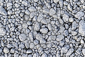 A close up of a pile of gray and white rocks