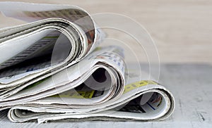 A close up of a pile of newspapers