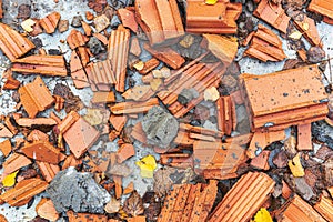 Close-up of a pile of old broken red bricks