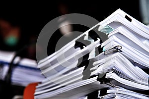 Close up of a pile of papers in a conference room, business concept