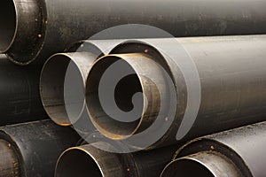 Close-up of a pile of pipes for underground heating mains