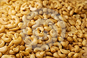 Close up pile of Roasted cashew nuts texture and background photo