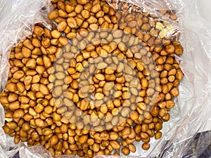 close up pile of skinless peanuts without shell