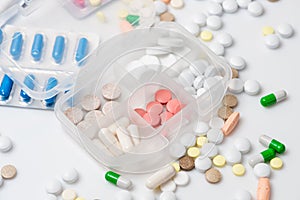 Close-up of pill case with various medications