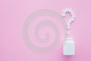 Close up of pills. Dietary supplements. Variety pills. Vitamin capsules on pink background