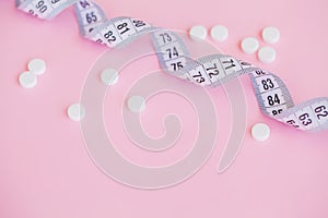 Close up of pills. Dietary supplements. Variety pills. Vitamin capsules on pink background