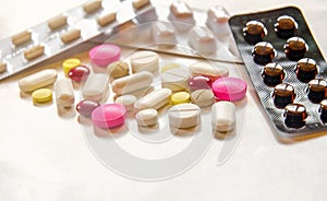 Close-up of the pills on the white background, The drug and capsule pills on the floor,