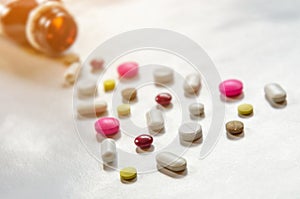 Close-up of the pills on the white background, The drug and capsule pills on the floor