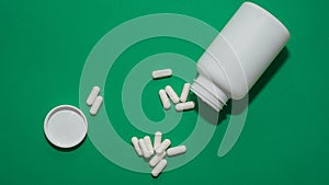 Close-up of pills,white capsules scattered on the floor,vitamins to maintain healthy,lifestyle
