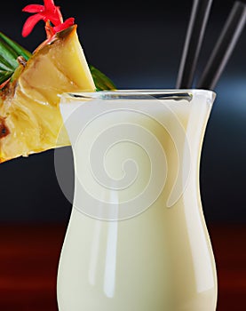 Close up of pina colada drink over black background created using generative ai technology