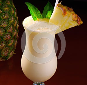 Close up of pina colada drink over pineapple created using generative ai technology