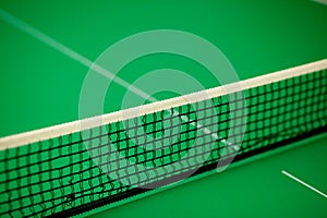 Close up ping pong net and line - green table