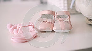 Close up of pink baby booties. 4k