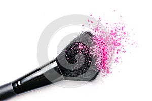 Close-up of pink blusher and brush for make-up