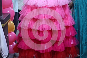 close up of pink color frill frock- party wear