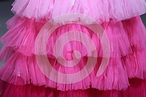 close up of pink color frill frock- party wear