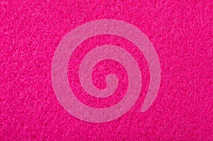 Close up on pink felt texture as a background.