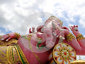 Close up of pink Ganesha statue recline posture.