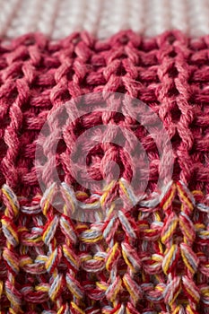 Close up of pink knitted wool texture