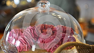 Close up for pink meringue cakes under the glass loche at french cafe patisserie, food concept. Art. Beautiful pink