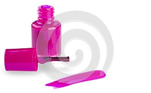 Close up of the pink nail polish bottle and drop on white background