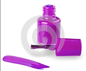 close up of a pink nail polish bottle and drop on white background. Selective focus