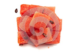 Close-up of pink organic watermelon citrullus Lanatus pieces or diced or sliced isolated over white background